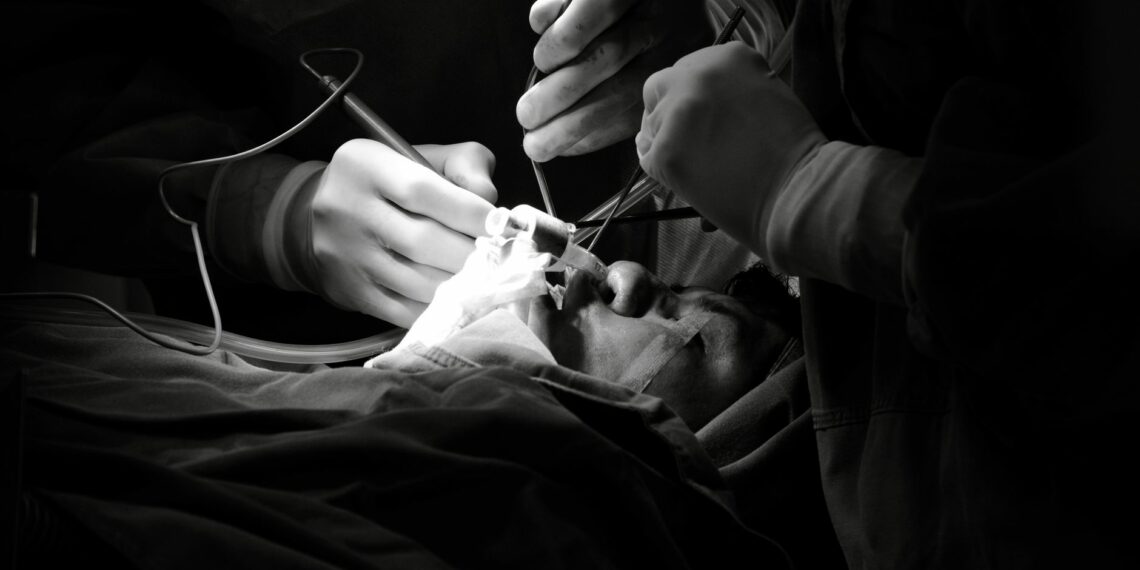 black and white surgical operation scene