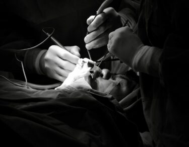 black and white surgical operation scene
