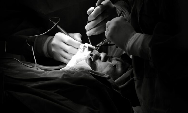 black and white surgical operation scene