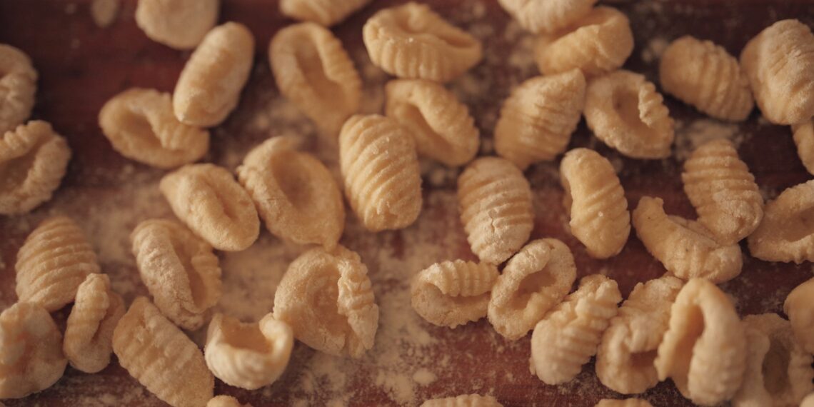 fresh homemade gnocchi on floured board