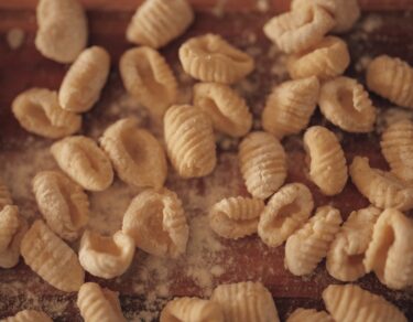 fresh homemade gnocchi on floured board