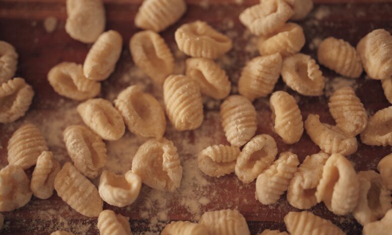 fresh homemade gnocchi on floured board