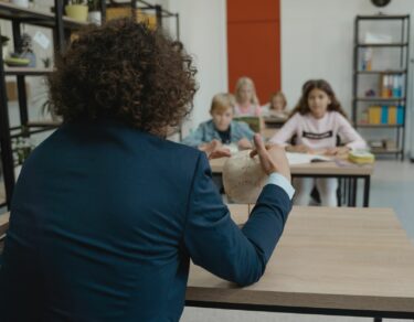 teacher showing class a human skull