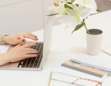 a person typing on the laptop